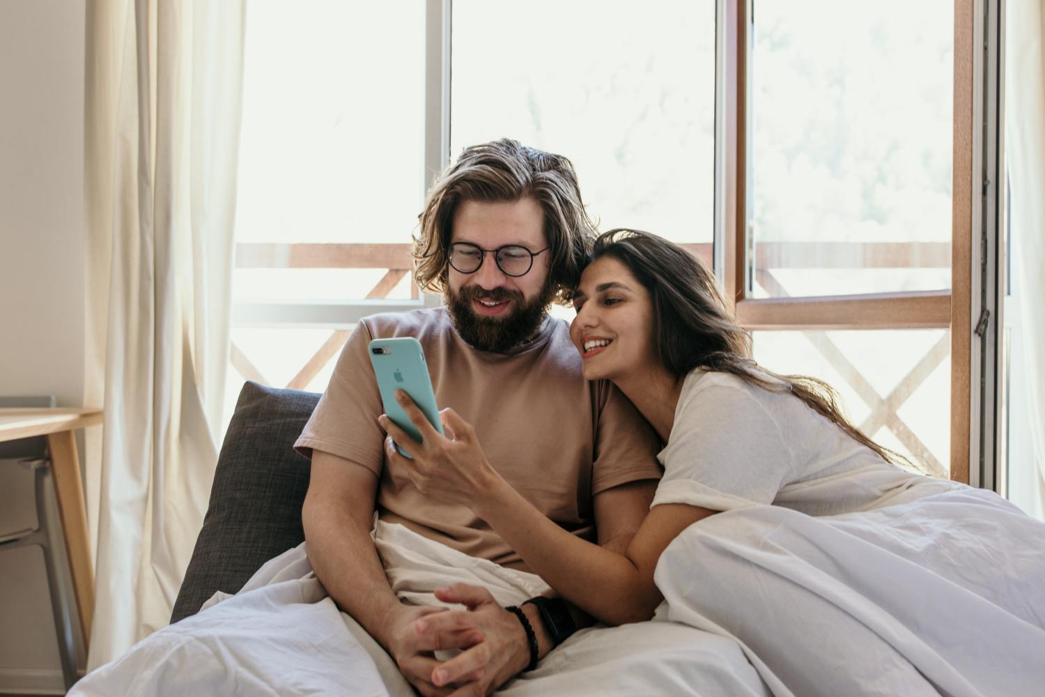 Couple living together learning more about cohabitation agreements.