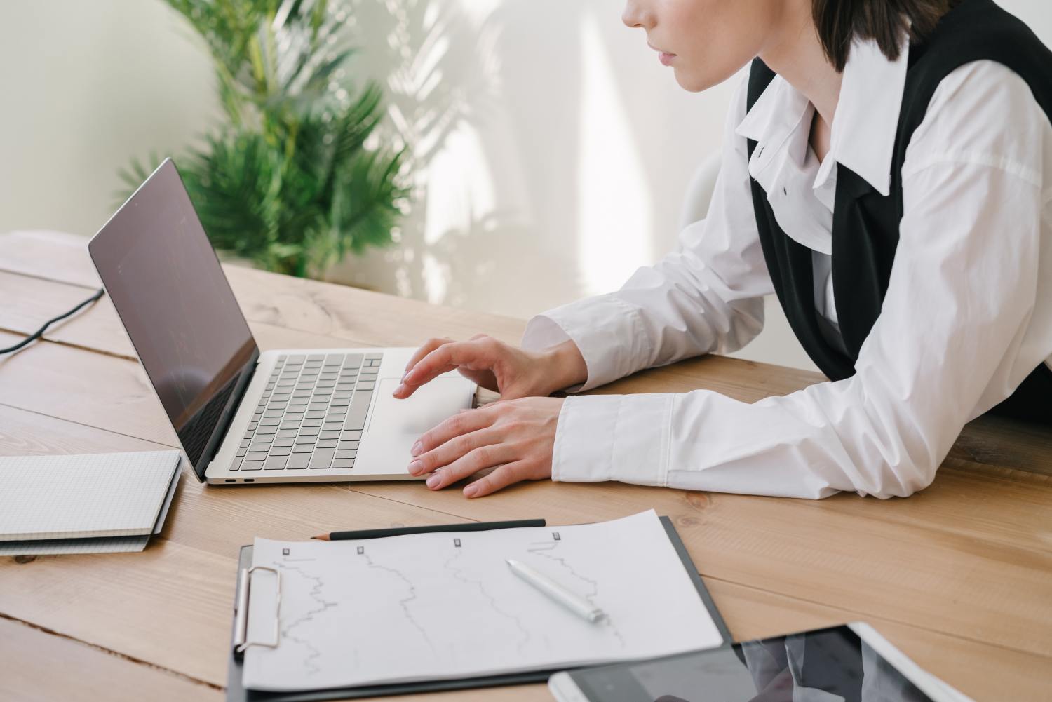 Woman on laptop researching how cryonic preservation works.