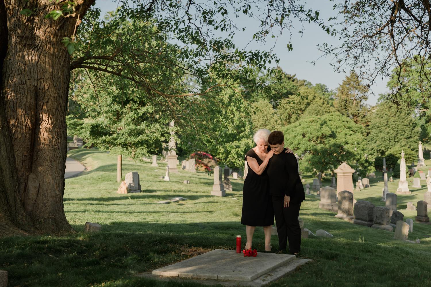 Women at funeral after learning why people say "godspeed."