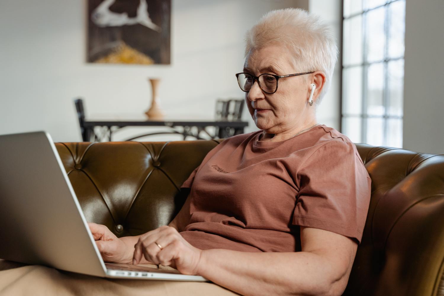 Woman on laptop researching how to buy probate property.