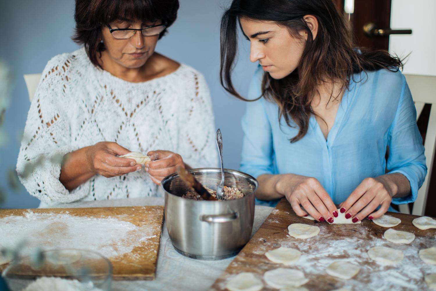 Mother and daughter cooking after learning how to win a partition action.