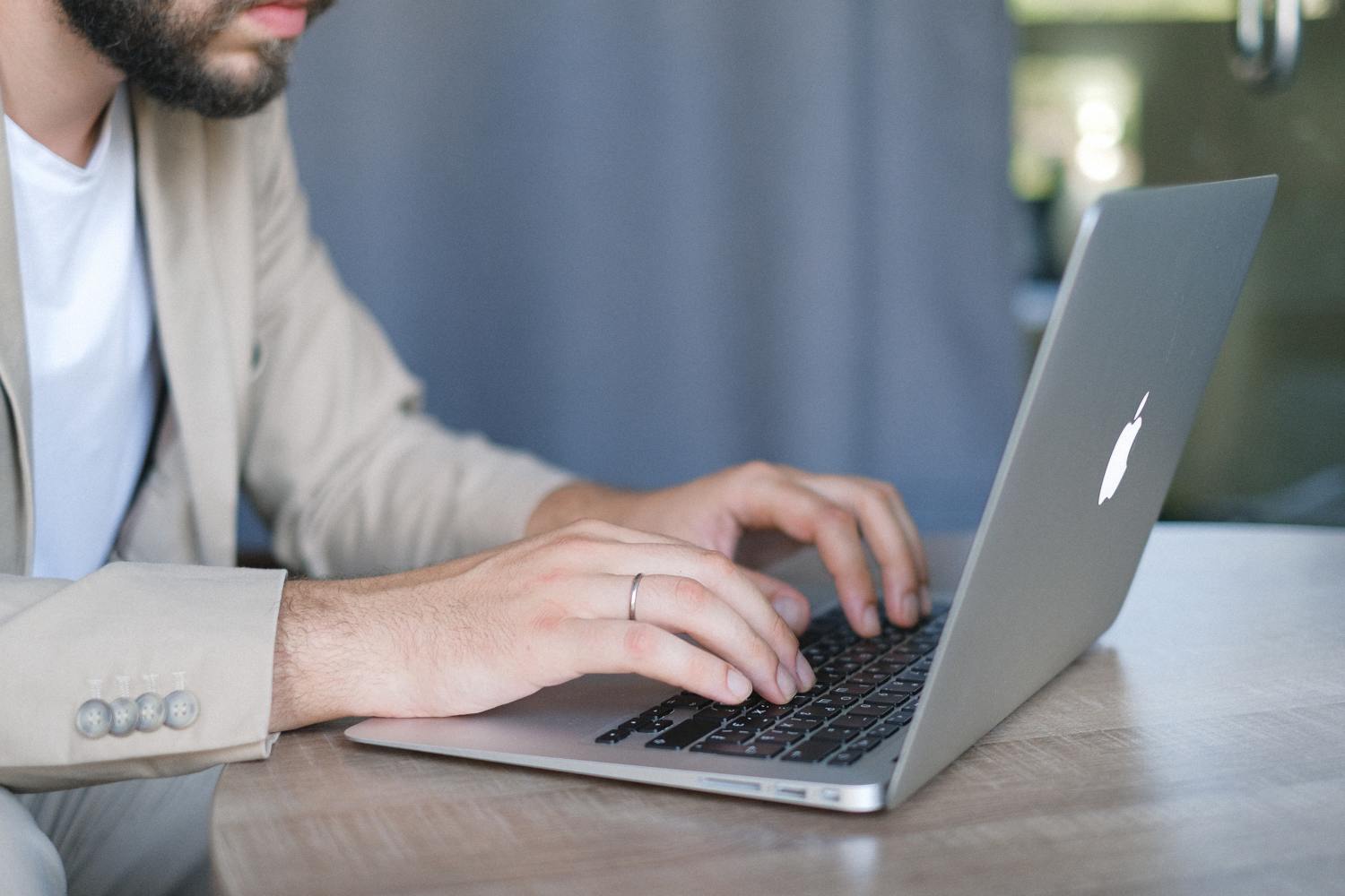 Person on laptop researching what they need to know about estate theft.