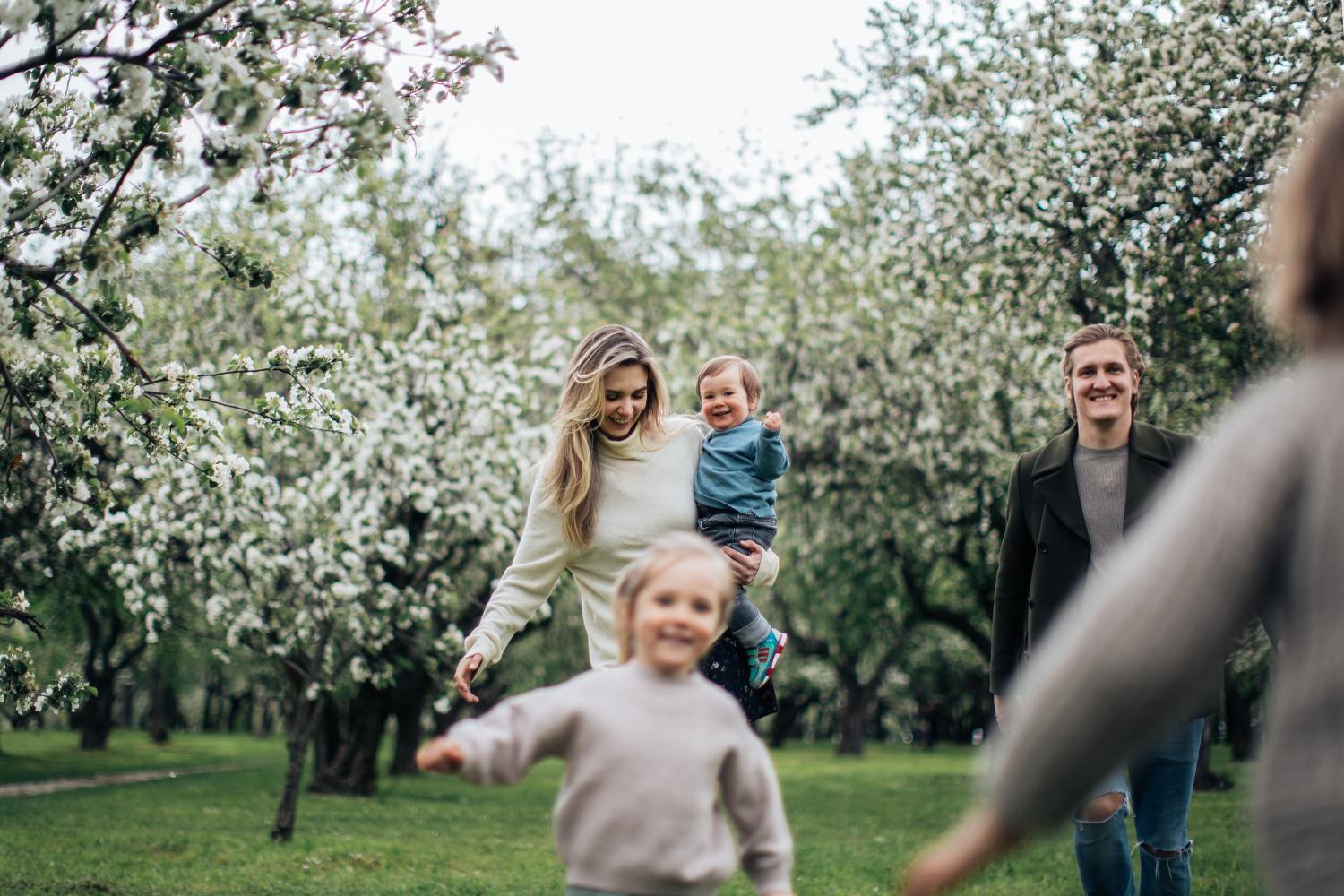 Family playing in park after learning what pro rata is.