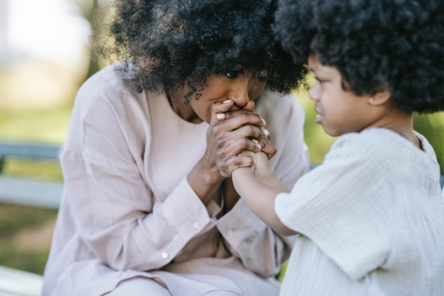 Mother with daughter after deciding if term vs whole life insurance was right for her family.