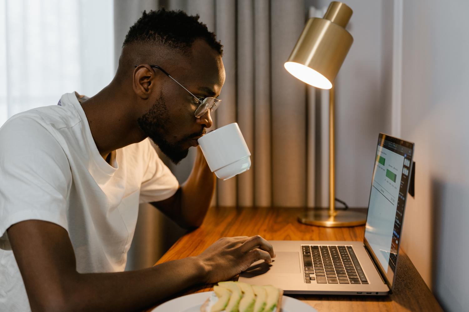 Man on laptop researching Texas homestead exemption and Trusts.