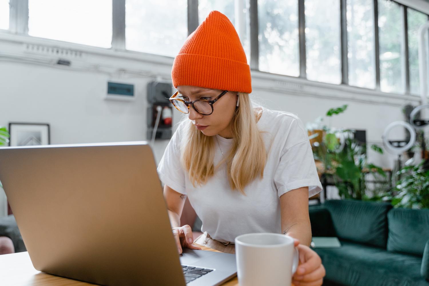 Woman researching what happens if I don't file for probate on laptop.