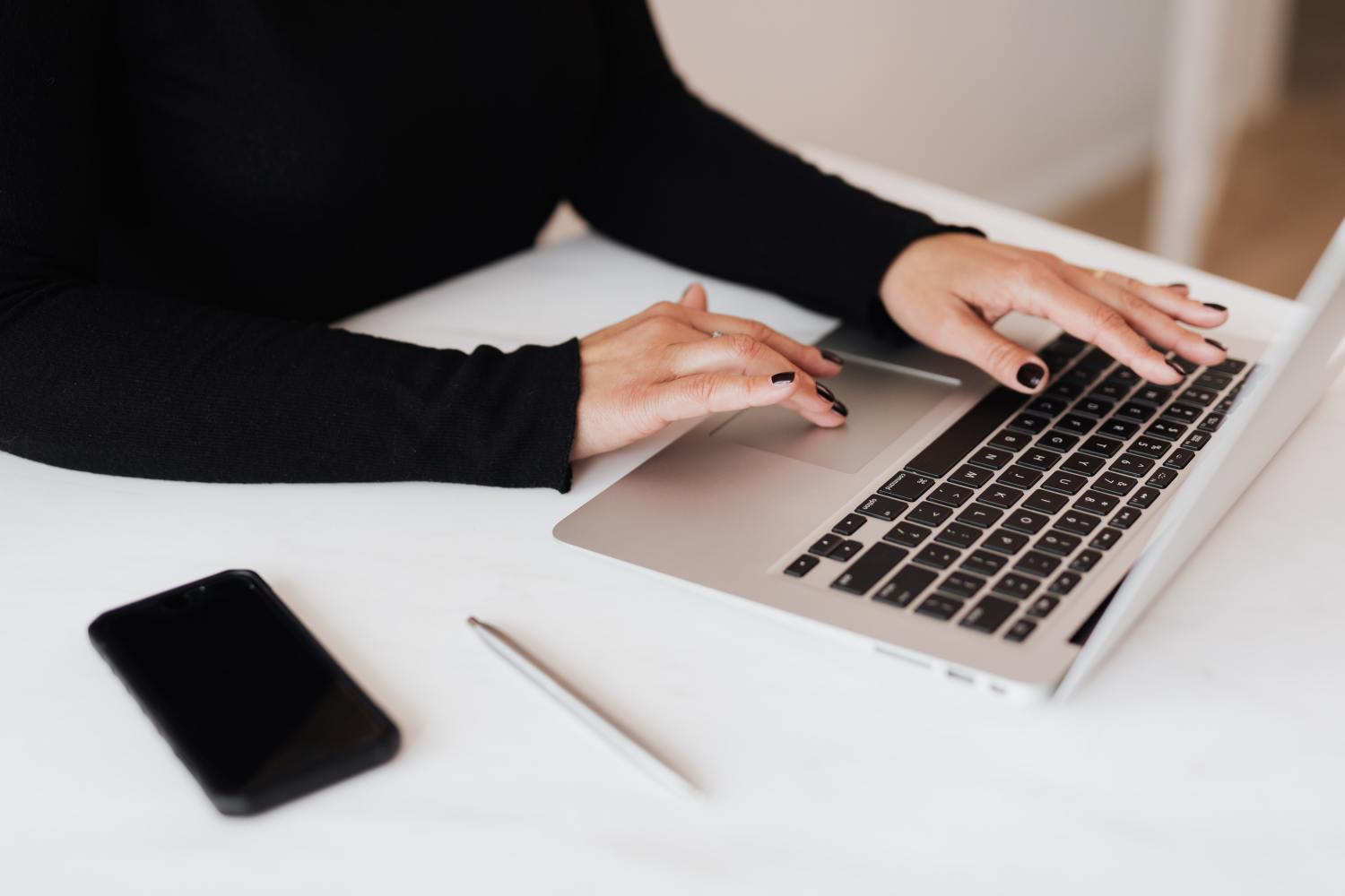 Woman researching what is a partition action on laptop.