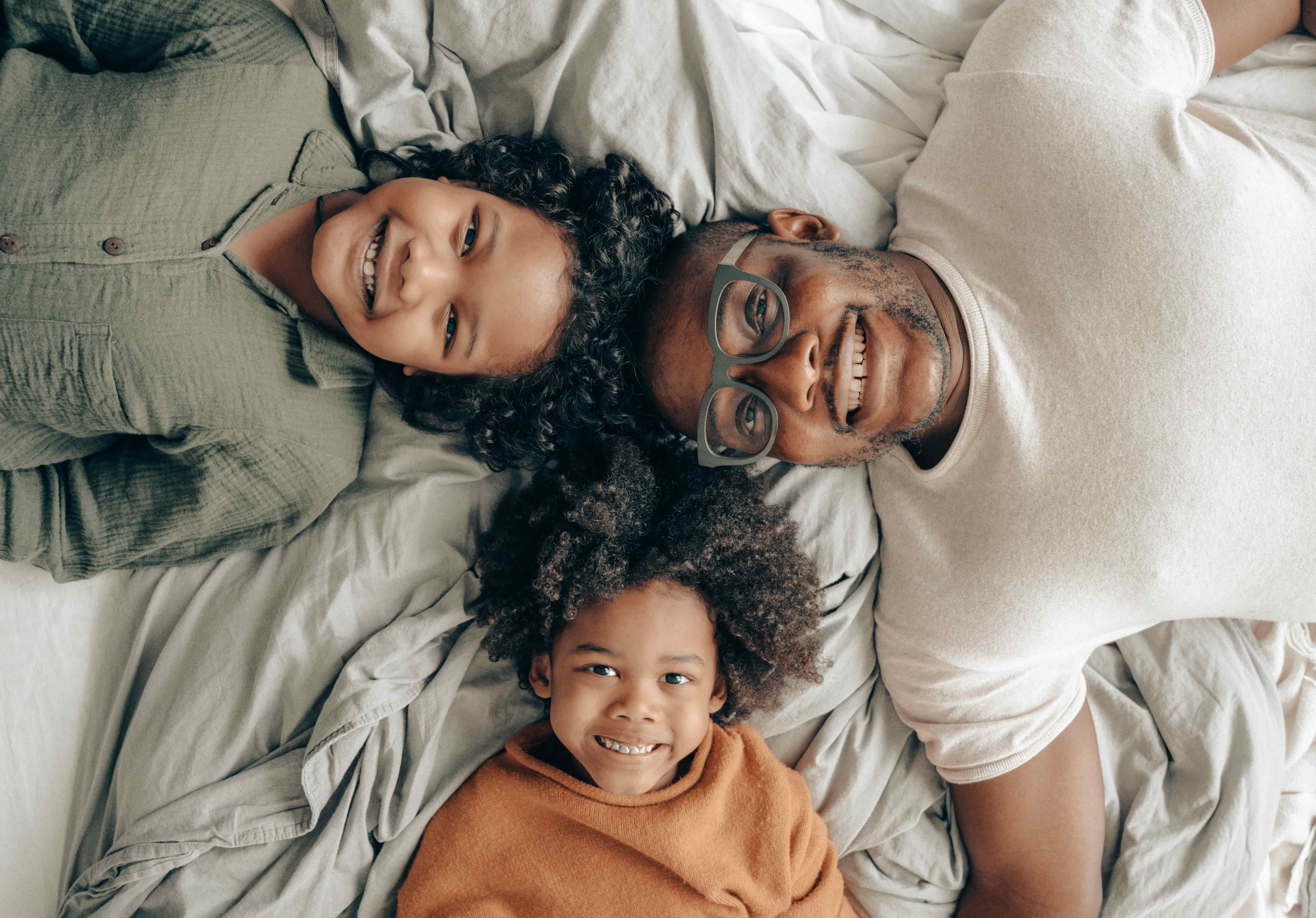 Parents smiling at children describing what is a trust fund.