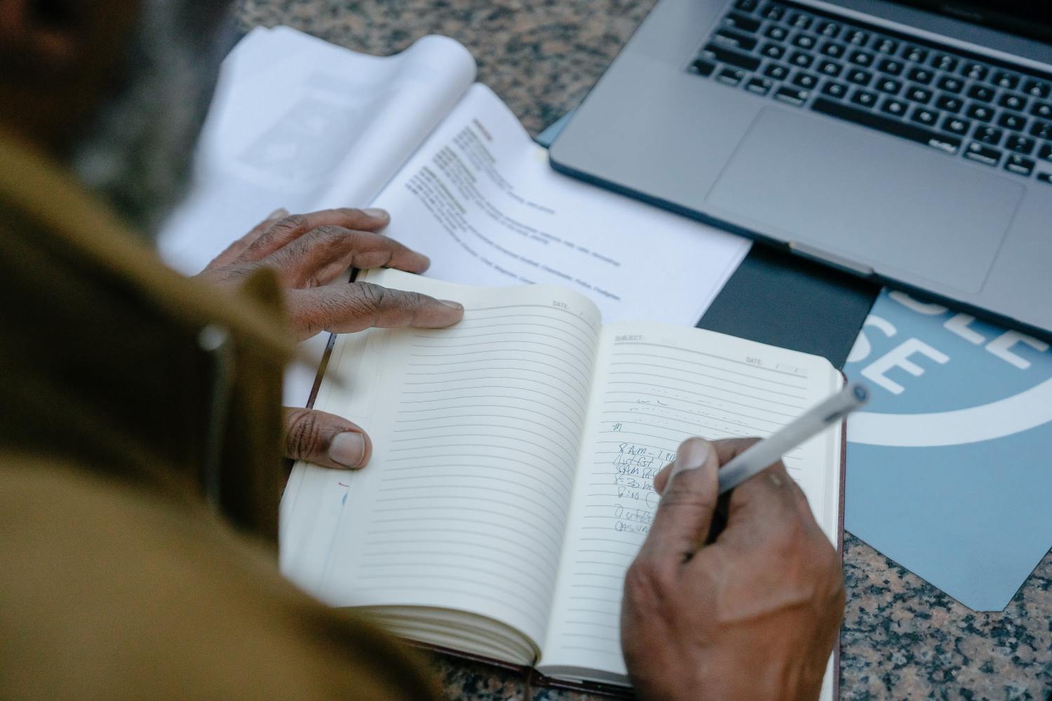 Man taking notes about who pays for a probate bond.